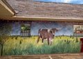 Painting of a longhorn steer on the brick sidewall of a gas station on Route 66 in Luther, Oklahoma.