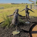 Bronze sculpture titled `Share the Dream` by sculptor Dennis Smith at the Founder`s Plaza Observation Area at DFW Airport. Royalty Free Stock Photo