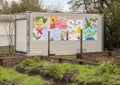 Small building and murals by teens at La Bajada Urban Youth Farm, Dallas, Texas