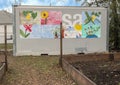 Small building and murals by teens at La Bajada Urban Youth Farm, Dallas, Texas