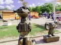 Sculpture of Cheburashka and Crocodile Genes illuminated by the sun