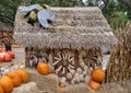 Photography spot with hay bales, pumpkins, and a straw house in the pumpkin patch at the Dallas Arboretum in Texas. Royalty Free Stock Photo