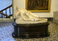Plaster cast of a sculpture of a man on the ground in The Pinacota Ambrosiana, the Ambrosian art gallery in Milan, Italy