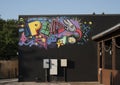 Play portion of the Colorful `Free Play` mural by artist Joe Skilz on the outside of the Free Play Arcade in Arlington, Texas.