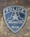 Police shield for a bronze sculpture by Seth Venable honoring police and fire service dogs in downtown Arlington, Texas.