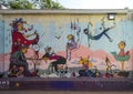 Portion of a large mural in the Plaza Walls Alley by Denise Duong in Oklahoma City.