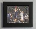 Privately owned photo of Dirk Nowitzki shooting a jump shot over a Brooklyn Nets player.