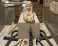 A Queen in the form of a Sphinx statue & the Royal Insignia on display in the NMEC in Cairo, Egypt.