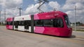 Red, pink and white Brookville Liberty Modern Streetcar in Oklahoma City, Oklahoma
