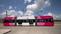 Red, pink and white Brookville Liberty Modern Streetcar in Oklahoma City, Oklahoma