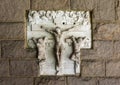 Relief of Station 12 of the Stations of the Cross in a garden wall in the Cloisters in New York City.