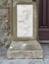 Relief of a winged lion in rampant position on the base of a pillar on the Cortona Cathedral in Cortona, Italy.