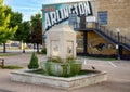 Replica fountain in front of `Historic Arlington` mural on the historic Vandergriff Office Building in Arlington, Texas. Royalty Free Stock Photo