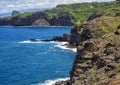 Rugged sheer lava cliffs along the coast of Maui near the Nakalele blowhole. Royalty Free Stock Photo