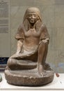 Sandstone statue of Hapi the scribe, the Administrator of the Amun temple, on display in the NMEC in Cairo, Egypt.