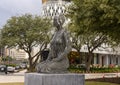 Sculpture of a kneeling woman made of steel plates on display in the Design District of Dallas, Texas