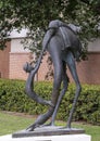 Whimsical bronze sculpture titled `Endangered Species` by David Cargill, located outside the World Trade Center in Dallas, Texas.