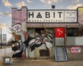 Habit Mural Festival office sign and mural at 868 East Admiral Boulevard in Tulsa, Oklahoma.