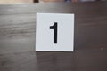 a sign with the number 1 on a table in a restaurant Royalty Free Stock Photo