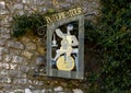 Sign for a pottery shop featuring a potter working on the wheel in Tourettes-sur-Loup, Provence, France