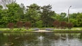 Small fountain, reflecting pool, garden and trees outside the Jewel Box in Forest Park in Saint Louis, Missouri. Royalty Free Stock Photo