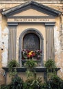 An small shrine to Maria SS.ma del Carmine on a narrow street in Sorrento, Italy