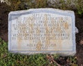 Small stone monument at the front of the Gazebo in the historic downtown square of Carrollton, Texas.