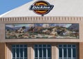 South facade of Dickies Arena with `Los Caballeros` mural by William Matthews flanked by bas-relief sculptures by Buckeye Blake.