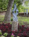 Springstone sculpture titled Birds in Flight by William Murenza in the Fort Worth Botanic Garden.