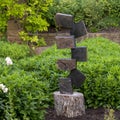 Springstone sculpture titled Ladder of Success by Bywell Sango in the Fort Worth Botanic Garden.