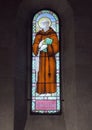 Stained glass of Saint Francis of Assisi in the Holy Savior Church in Castellina in Chianti, Italy.with Royalty Free Stock Photo