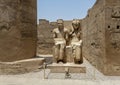 Statue of the god Amun-Re and his wife Mut just before the Colonnade Hall in Luxor Temple, Egypt. Royalty Free Stock Photo