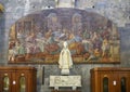 Statue of Pope John Paul II with painting of the Lord`s Supper, Genoa Cathedral