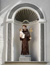Statue of Saint Anthony of Padua in alcove on front of the Church of Corpus Christi,Klastery, Cesky Krumlov, Czech Republic