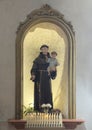 Saint Anthony of Padua statue in the Church of Santa Maria Sopra Minerva in the Communal Square of Assisi in Italy. Royalty Free Stock Photo