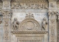 Cherubs flanking the symbol of Seville on the facade of the Seville Town Hall facing Plaza de San Francisco. Royalty Free Stock Photo