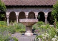 Stone fountain in a garden in the Cloisters in New York City.