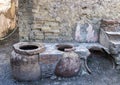 Street food bar with pots to keep food hot in the remains of Herculaneum Parco Archeologico di Ercolano Royalty Free Stock Photo