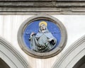 Terracotta relief of a Franciscan saint by Andrea della Robbia in a spandrel of the Hospital of San Paolo in Florence, Italy. Royalty Free Stock Photo