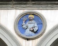 Terracotta relief of a Franciscan saint by Andrea della Robbia in a spandrel of the Hospital of San Paolo in Florence, Italy. Royalty Free Stock Photo