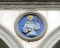 Terracotta relief of a Franciscan saint by Andrea della Robbia in a spandrel of the Hospital of San Paolo in Florence, Italy. Royalty Free Stock Photo