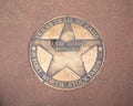 Texas Trail of Fame star honoring the bootmaker Enid Justin in the Forth Worth Stockyards in Texas.