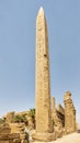 Thutmose I Obelisk with the 3rd Pylon and the South side Hypostyle Hall in background in Karnak Temple complex near Luxor, Egypt. Royalty Free Stock Photo