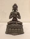 Tibet bronze 17th century statue of a mahasiddha on display in the Dallas Museum of Art.