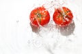 Tomato and water splashing