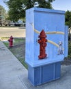 Traffic signal box painting by artist Karen Cox at Fire Station #1 in Grand Prairie, Texas.