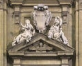 Triangular tympanum with statues representing Faith and Charity on the facade of San Gaetano in Florence, Italy. Royalty Free Stock Photo