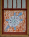 Turtle with lotus flower painted on a window outside the Cosmic Cafe on Oak Lawn in Dallas, Texas.