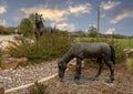 Bronze mare and colt on a traffic circle in the City of Colleyville, Texas.