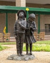 Two of seven sculptures of `Pledge of Allegiance` by Glenna Goodacre at Scottish Rite Hospital for Children in Dallas, Texas.